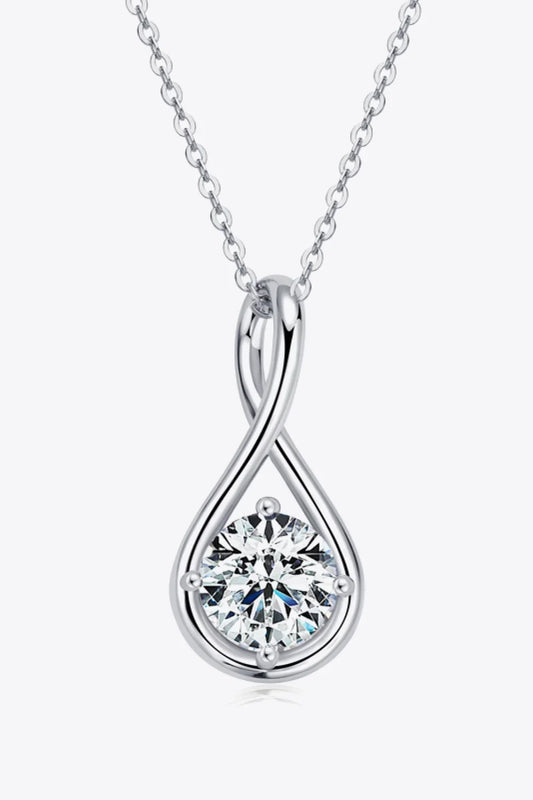 Silver teardrop necklace with a round clear gemstone pendant on a fine chain, minimalist style