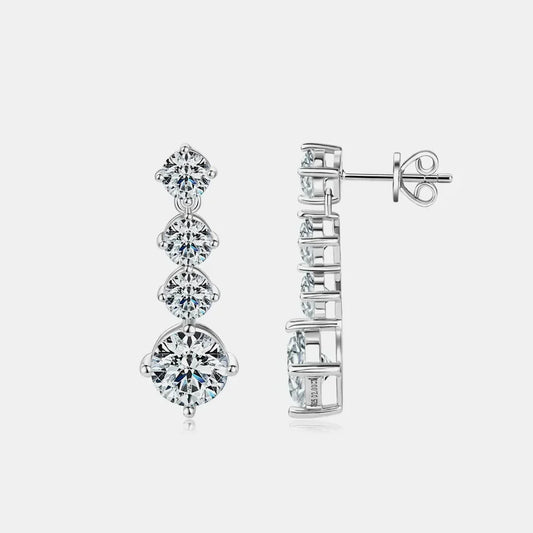 Elegant silver drop earrings with four round clear gemstones on a white background.