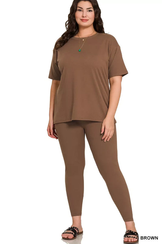 Woman in relaxed brown short sleeve top and matching leggings set, studio background