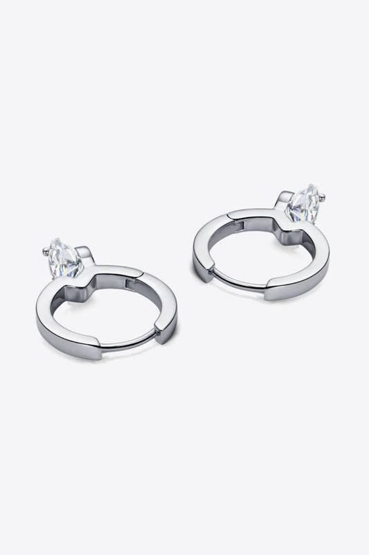 Pair of silver hoop earrings with marquise-cut clear gemstones on a white background
