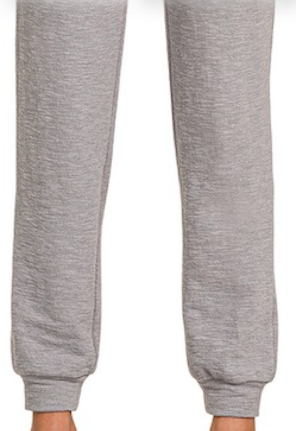 Close-up of a person's legs wearing heather Grey Zenana Cotton Slub Jogger Pants against a plain white background.