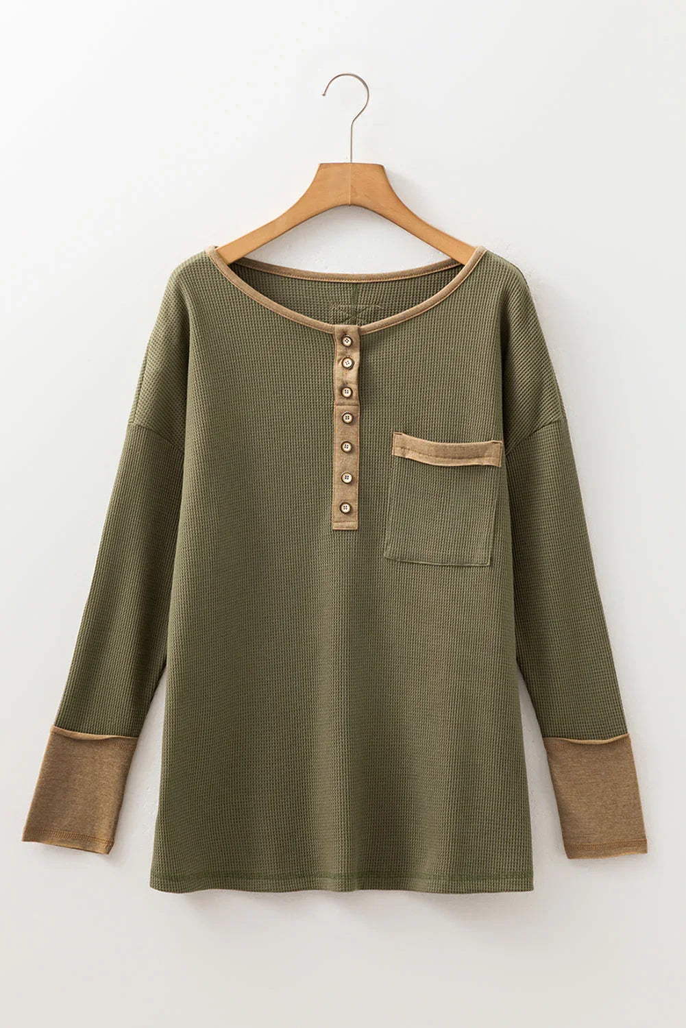 Olive green long sleeve waffle knit henley top with tan trim, buttons, and chest pocket