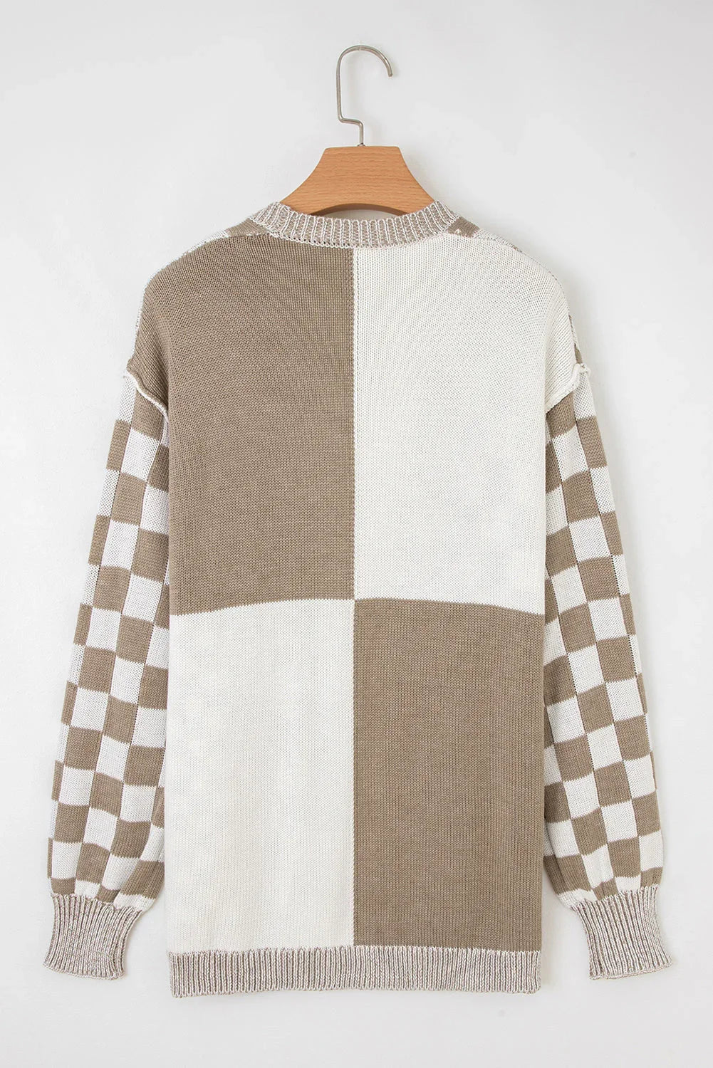 Beige and white checkerboard knit sweater with colorblock back and relaxed sleeves