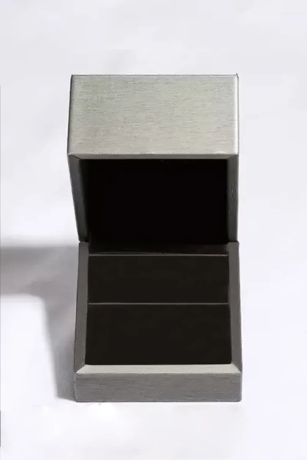 Open empty silver jewelry box on a plain white background