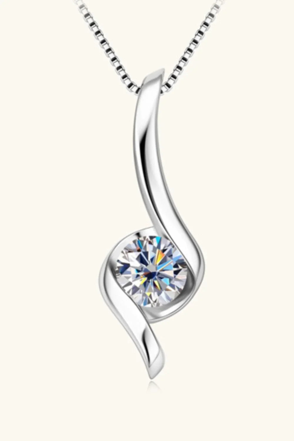 Elegant silver pendant necklace with a round clear gemstone and modern swirl design