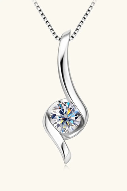 Elegant silver pendant necklace with a round clear gemstone and modern swirl design