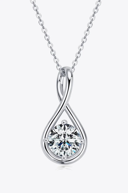 Silver teardrop necklace with a round clear gemstone pendant on a fine chain, minimalist style