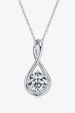 Silver teardrop necklace with a round clear gemstone pendant on a fine chain, minimalist style