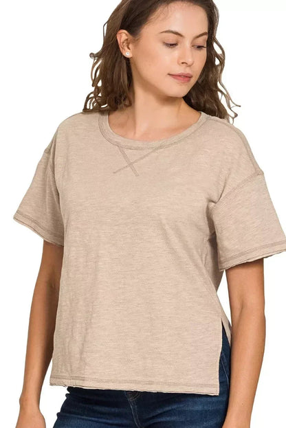 Woman wearing a relaxed fit ash mocha short sleeve t-shirt with crew neckline