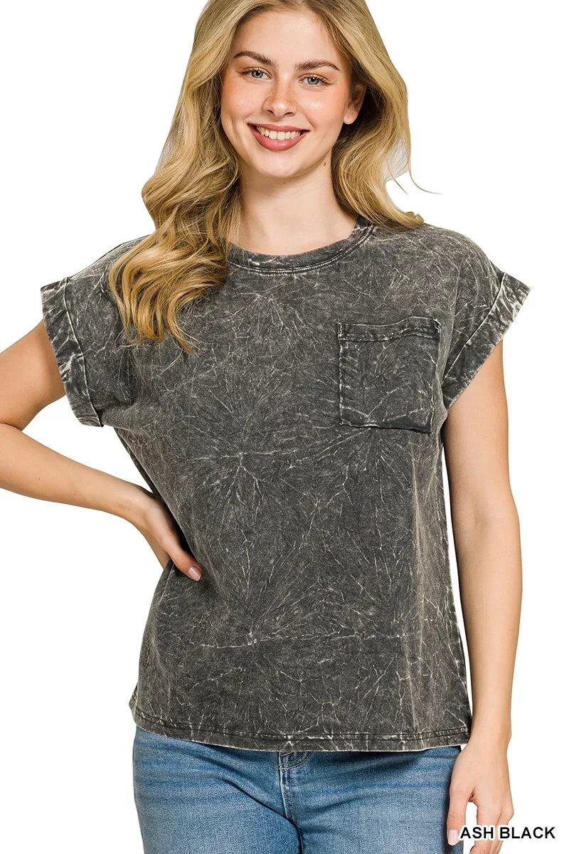 Woman wearing an ash black washed t-shirt with rolled sleeves and front pocket