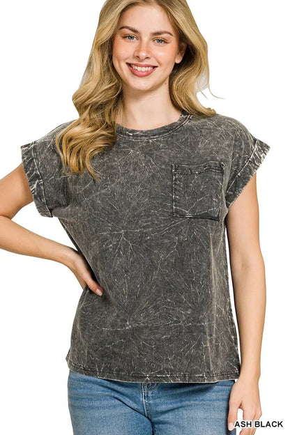Woman wearing an ash black washed t-shirt with rolled sleeves and front pocket