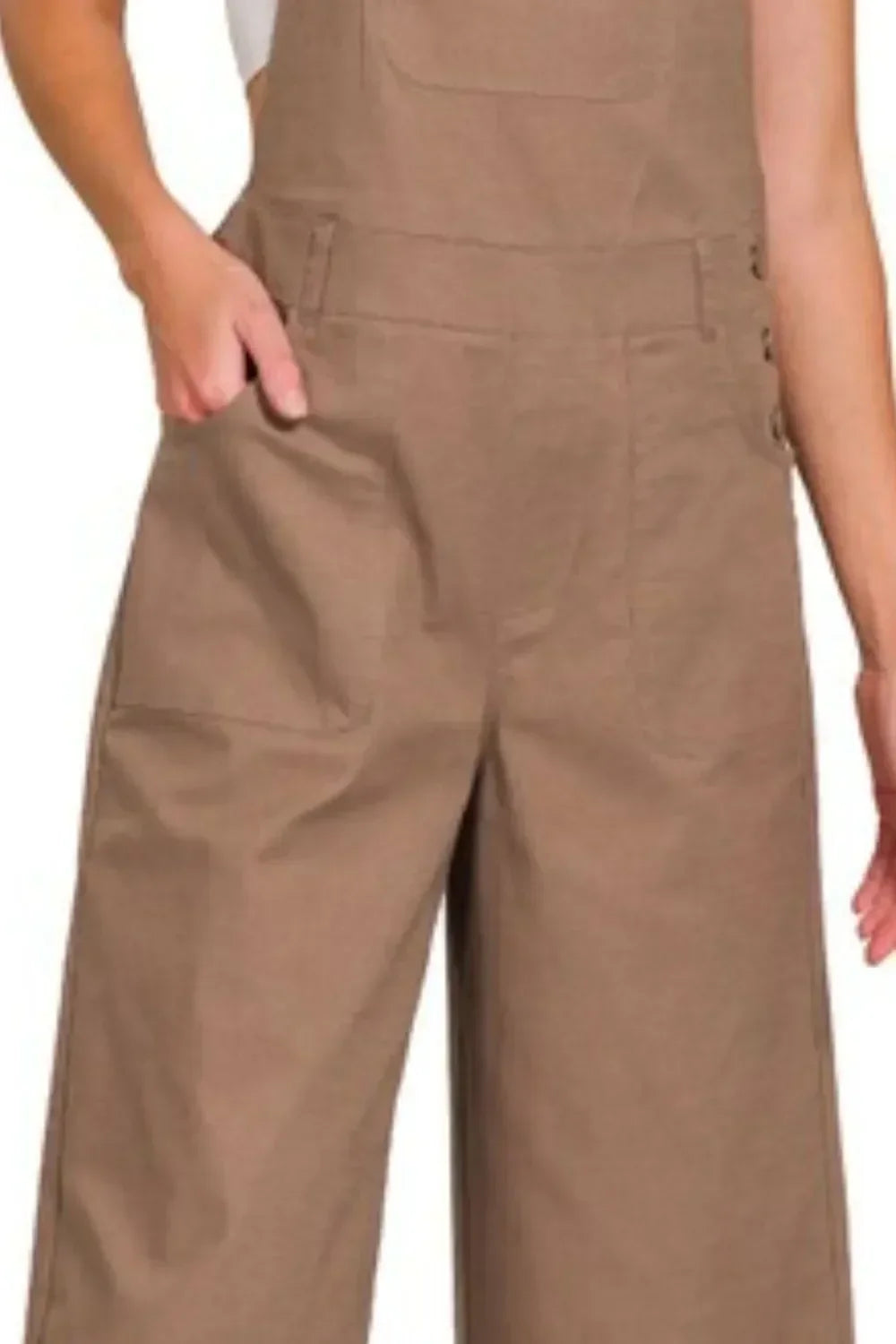 Wide leg tan overalls with front pockets and side buttons, relaxed fit