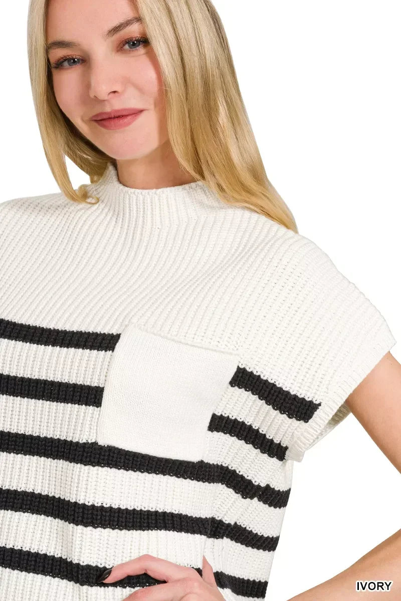 Woman wearing an ivory short sleeve knit top with black horizontal stripes and front pocket