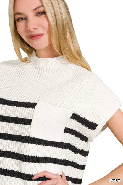 Woman wearing an ivory short sleeve knit top with black horizontal stripes and front pocket