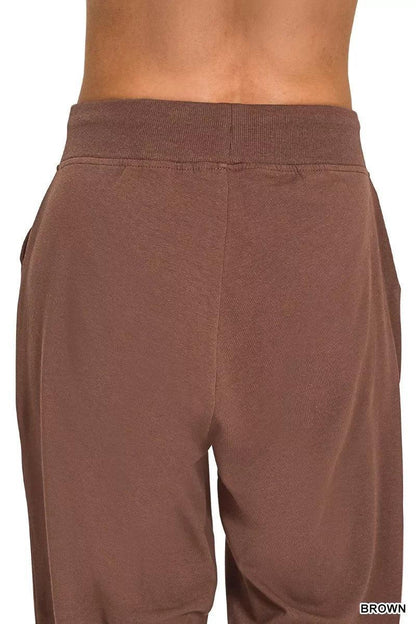 Back view of brown high-waisted relaxed fit lounge pants with elastic waistband