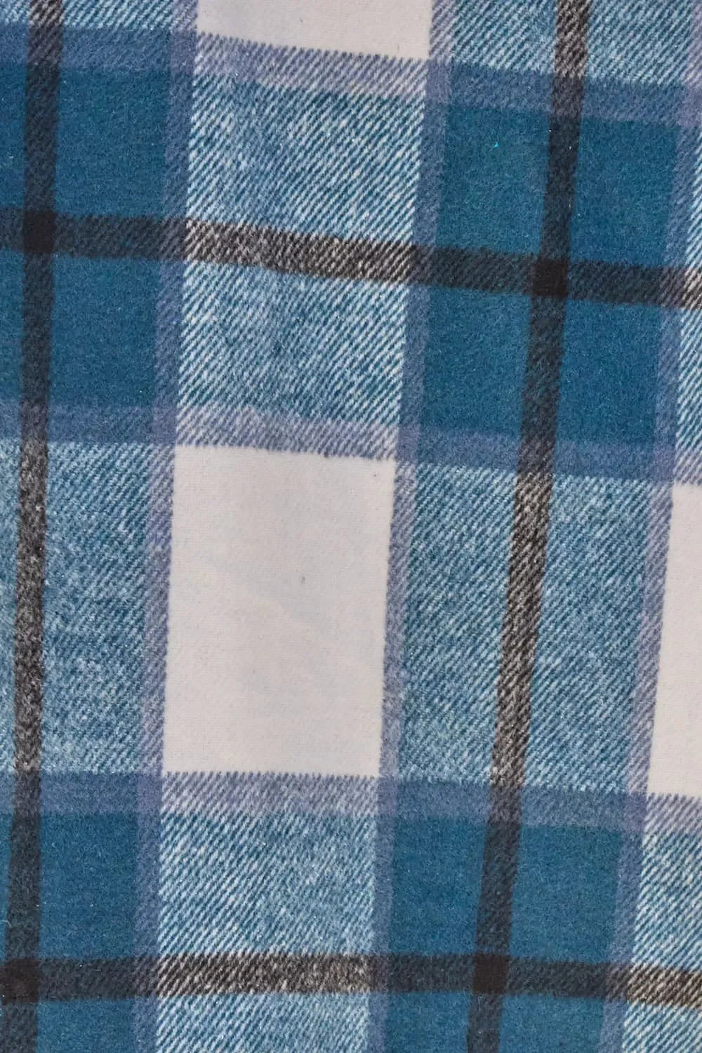 Blue and white plaid fabric with black and gray stripes, close-up textile pattern