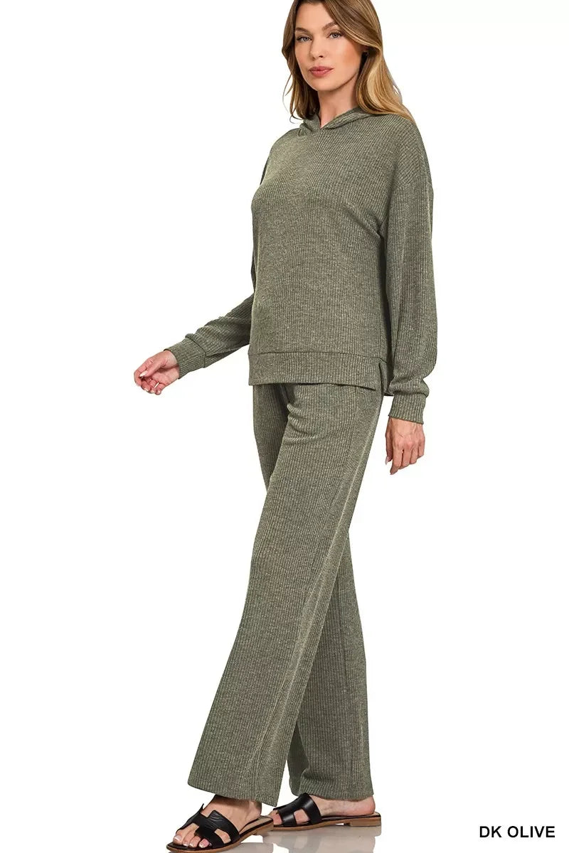 Woman wearing dark olive ribbed knit lounge set with long sleeves and wide-leg pants
