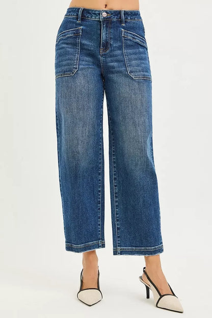 Wide leg cropped blue jeans with front patch pockets, styled with pointed heels