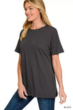Woman wearing a black relaxed fit short sleeve t-shirt and blue jeans