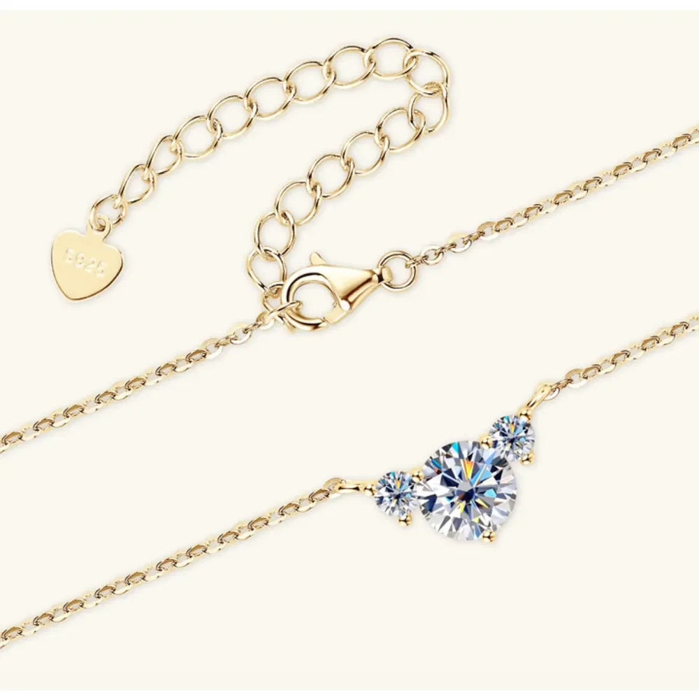 Gold chain necklace with lobster clasp and three round clear gemstones, elegant minimalist jewelry