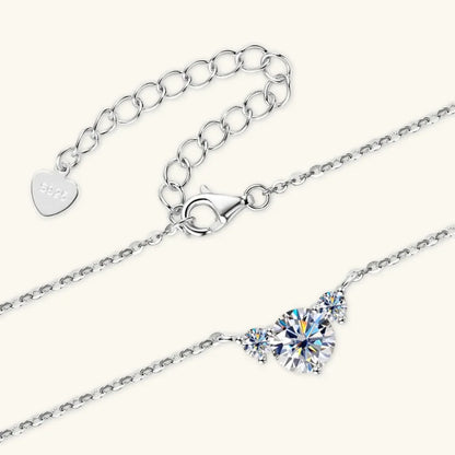 Sterling silver chain bracelet with cubic zirconia center stones and heart charm clasp