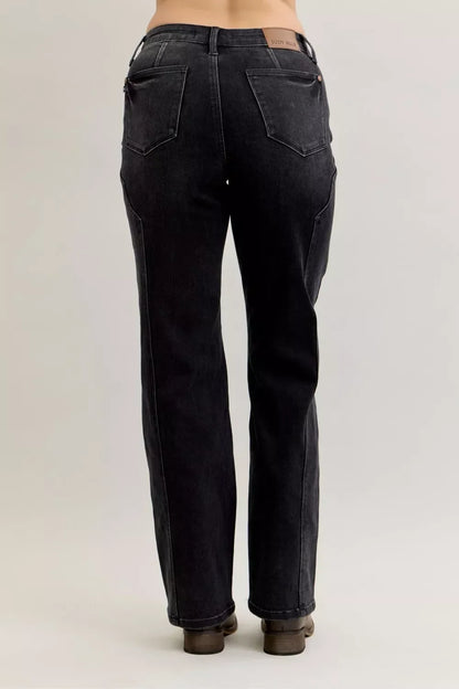 Back view of high-rise, straight-leg black denim jeans with patch pockets