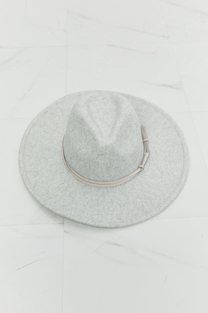 a wide brim Gray felt fedora hat with a leather tie detail on a white background