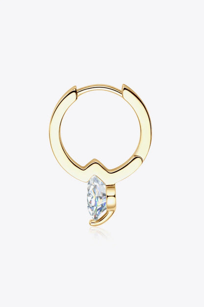 Gold hoop earring with a marquise-cut clear gemstone on white background