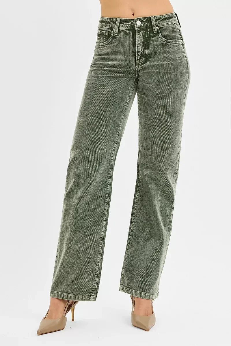 Woman wearing green corduroy high-waisted wide-leg pants with front pockets