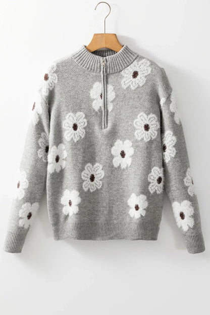 Light grey floral knit pullover sweater with white daisy pattern and half-zip collar.