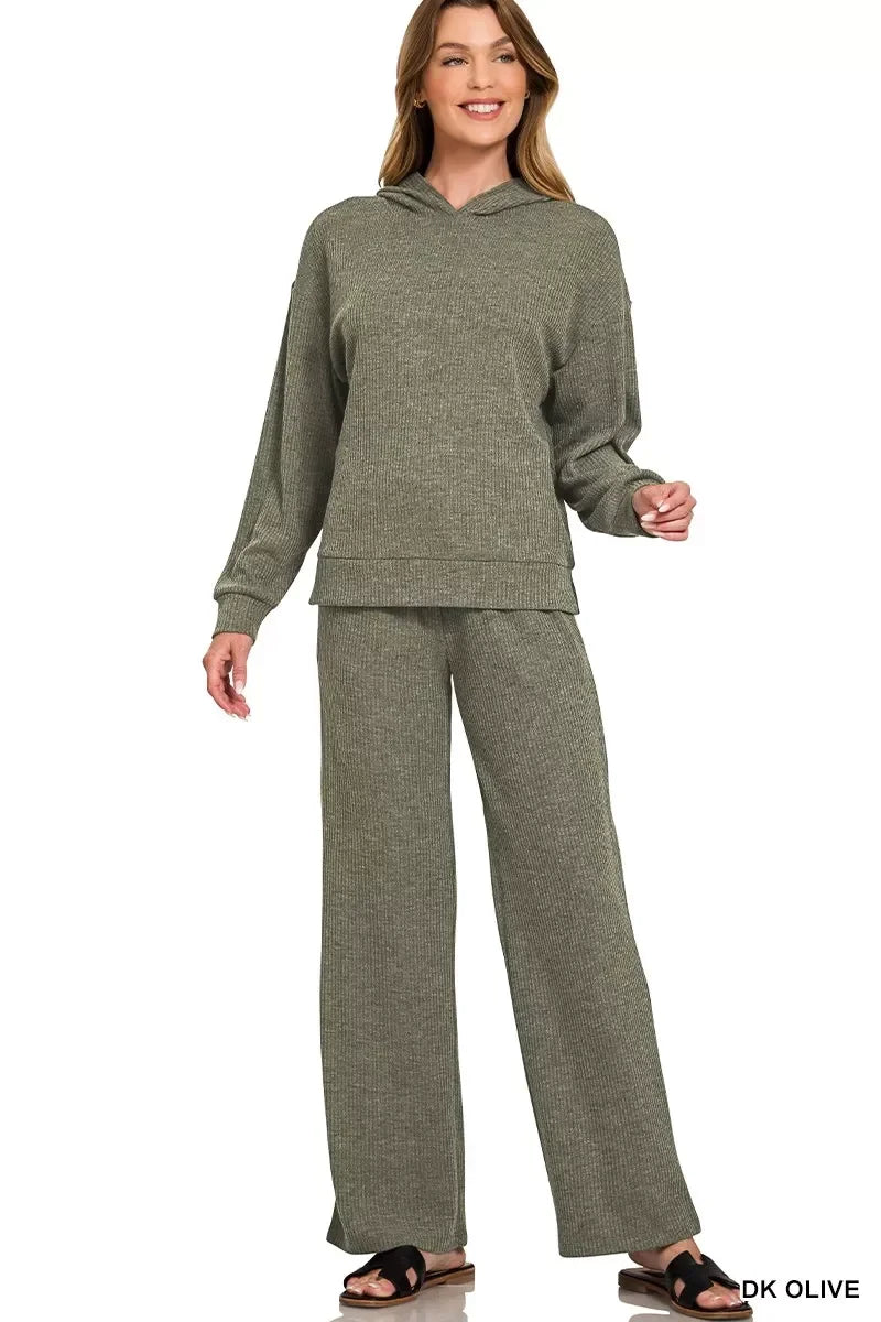 Woman wearing a ribbed knit dark olive lounge set with hoodie and wide-leg pants