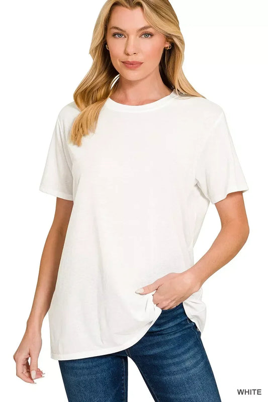 Woman wearing a relaxed fit white t-shirt and blue jeans, casual modern style