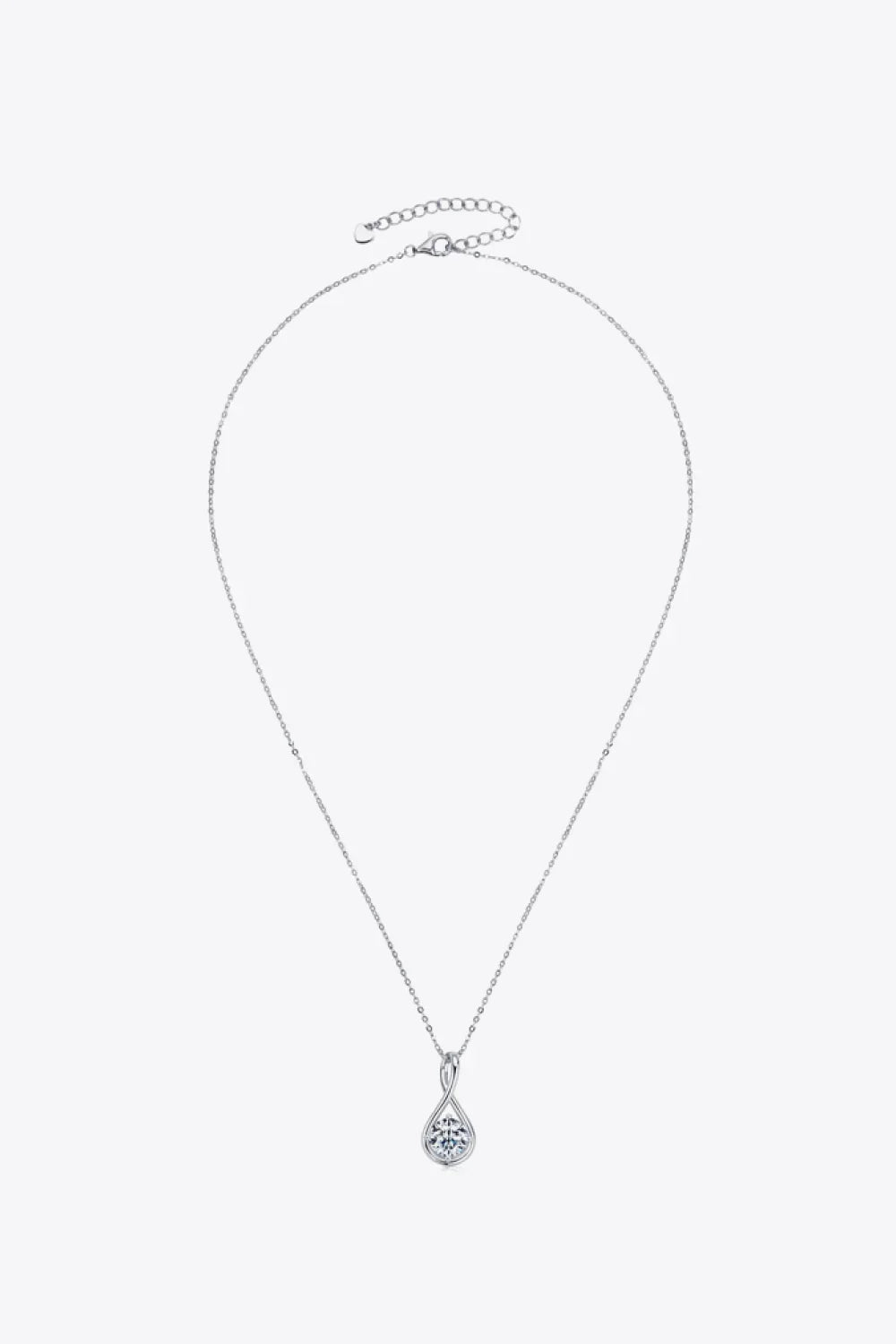 Silver chain necklace with round teardrop pendant featuring a clear gemstone on white background.