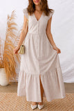 Woman wearing a sleeveless striped button-front maxi dress with ruffle sleeves.