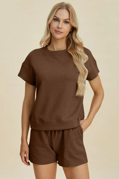 Woman wearing textured brown short-sleeve top and matching high-waisted shorts set