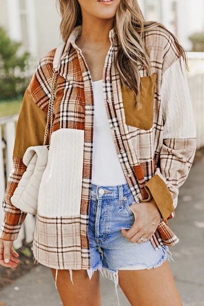 Woman wearing a plaid patchwork shacket, white tank top, denim shorts, and quilted shoulder bag