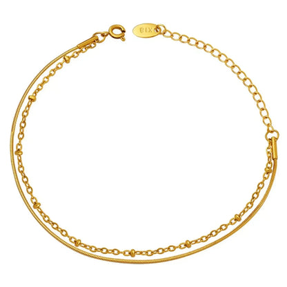 Delicate double-layer gold anklet with adjustable chain and lobster clasp, minimalist jewelry