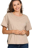 Woman wearing a relaxed fit ash mocha short sleeve t-shirt with crew neckline
