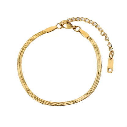 Gold herringbone chain bracelet with adjustable clasp on white background