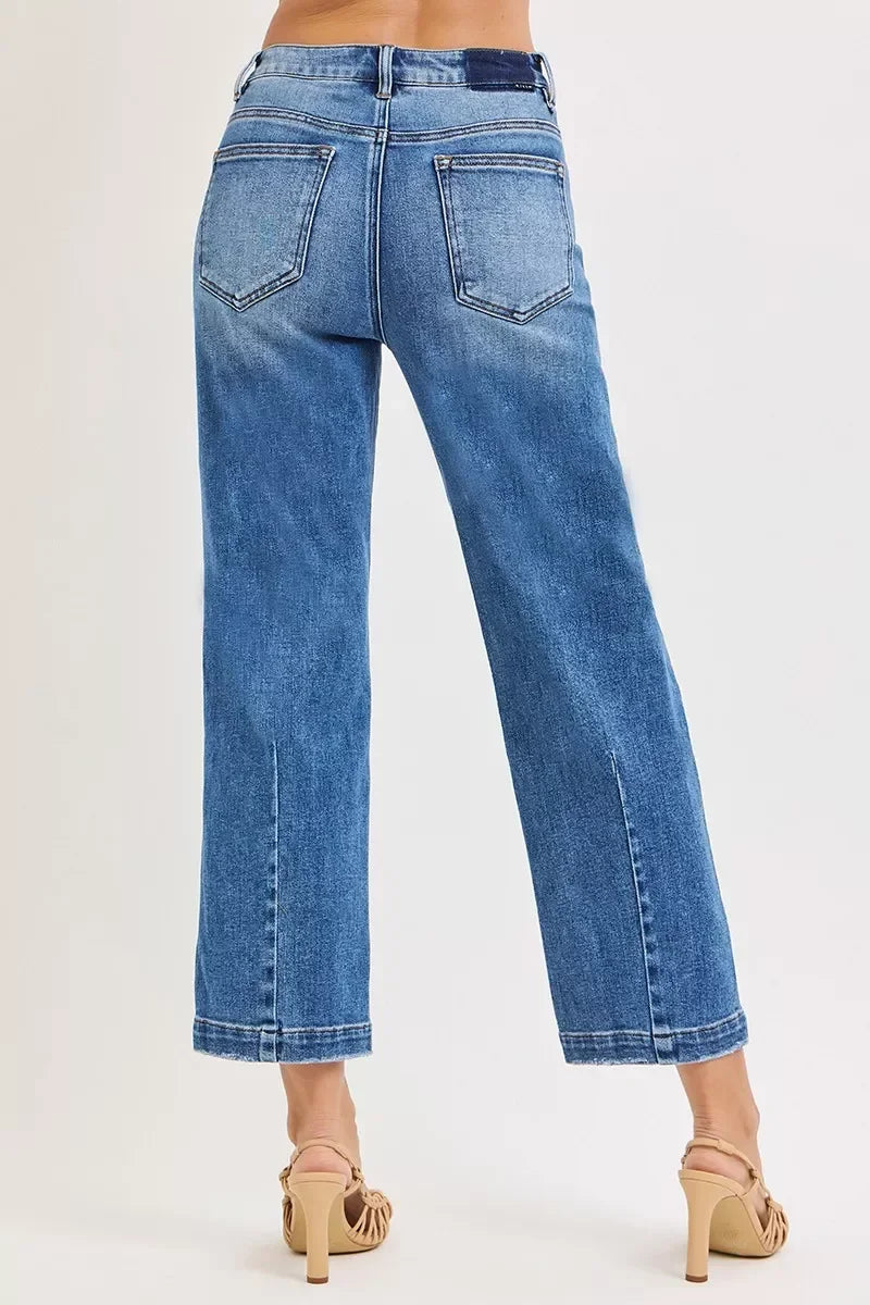 Back view of wide-leg blue denim jeans with classic pockets and high waist.