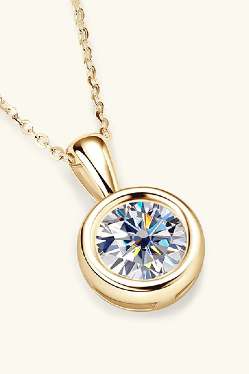 Gold chain necklace with round bezel-set clear gemstone pendant, minimalist jewelry