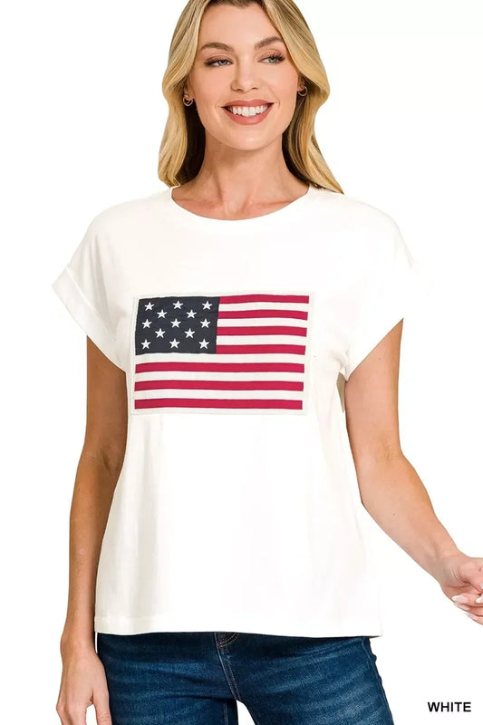 Woman wearing a white t-shirt with American flag graphic, casual denim style
