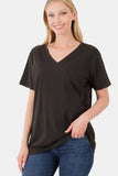 Woman in black V-neck short sleeve relaxed fit t-shirt and blue jeans against white background