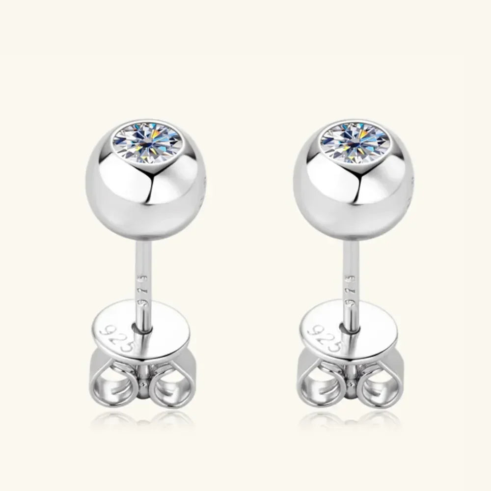 Sterling silver stud earrings with round cubic zirconia in a sleek minimalist setting