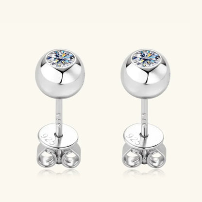 Sterling silver stud earrings with round cubic zirconia in a sleek minimalist setting