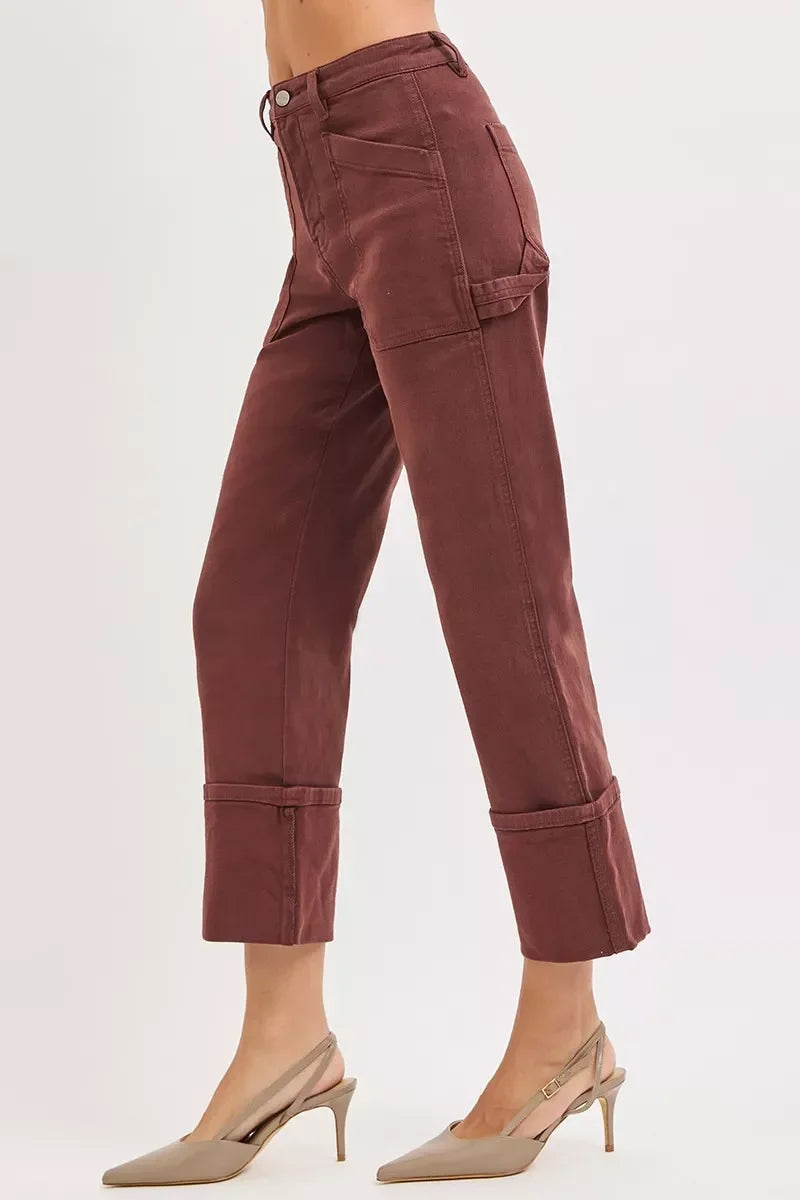 Side view of woman wearing high-waisted, cropped mauve pants with tailored details