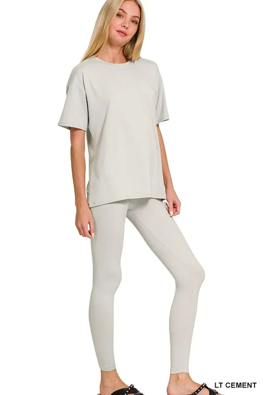 Woman wearing light cement oversized t-shirt and matching leggings set