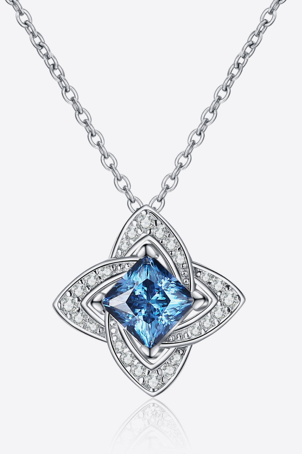 Silver necklace with a blue square gemstone pendant and sparkling crystal accents