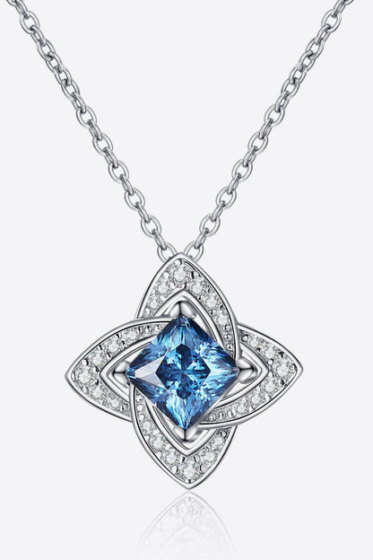 Silver necklace with a blue square gemstone pendant and sparkling crystal accents