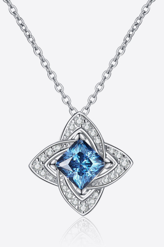 Silver necklace with a blue square gemstone pendant and sparkling crystal accents